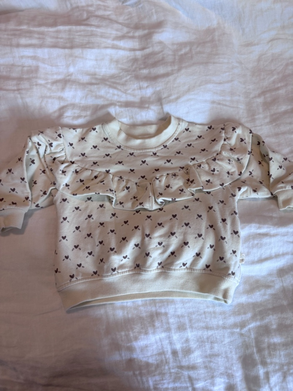 Quincy Mae Cream Sweatshirt with Purple Heart Print and Ruffle